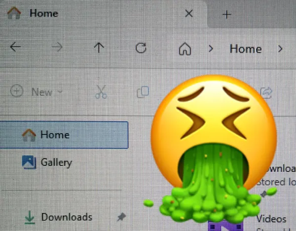 A photograph of a computer screen showing rows of pixels on the homescreen. A vomiting emoji is superimposed on top.